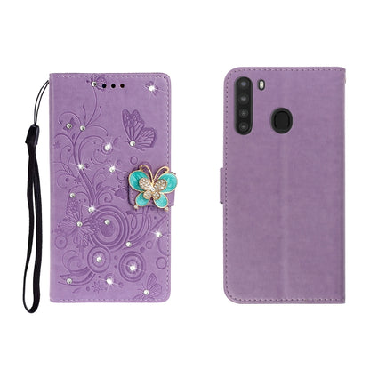 Purple embossed leather phone wallet case with butterfly rhinestone clasp, card slots, wrist strap.