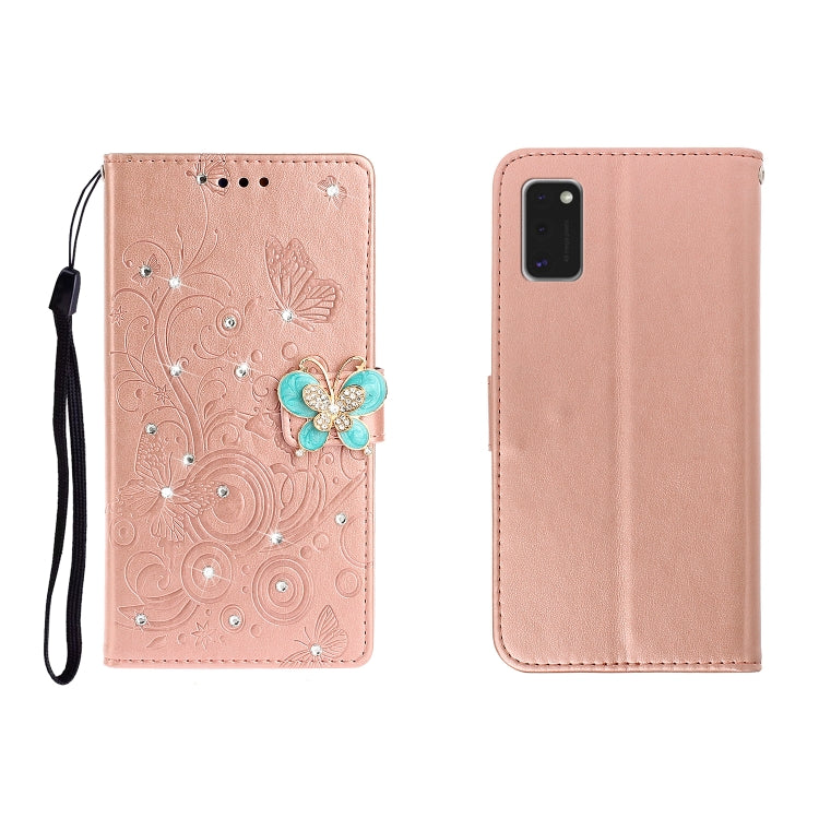 Rose gold embossed leather phone wallet case with butterfly rhinestone clasp, card slots, wrist strap.