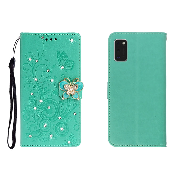 Green embossed leather phone wallet case with butterfly rhinestone clasp, card slots, wrist strap.