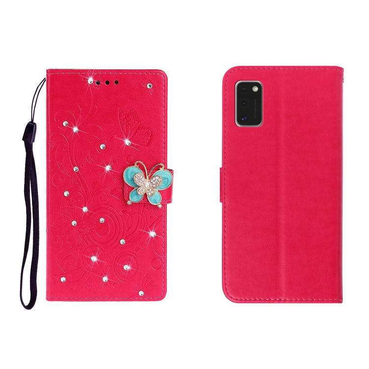 Red embossed leather phone wallet case with butterfly rhinestone clasp, card slots, wrist strap.