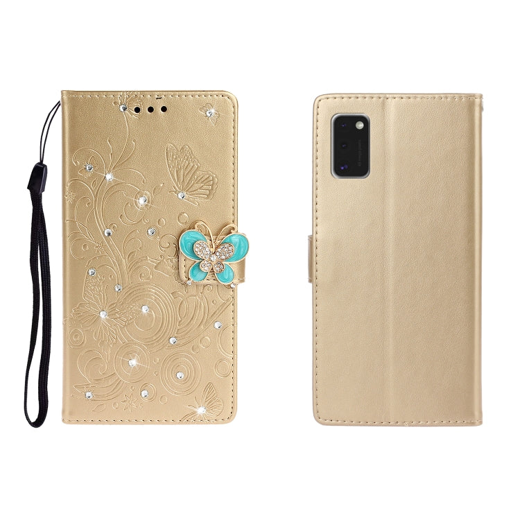 Golden-beige embossed leather phone wallet case with butterfly rhinestone clasp, card slots, wrist strap.