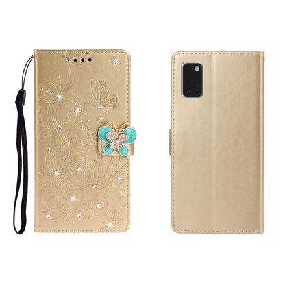 Golden-beige embossed leather phone wallet case with butterfly rhinestone clasp, card slots, wrist strap.