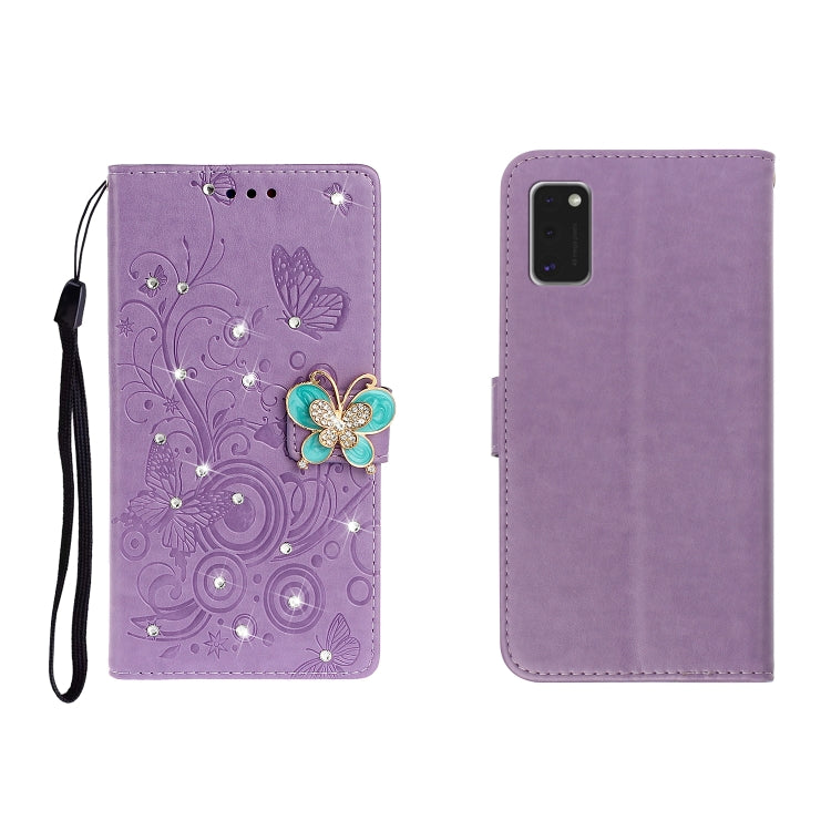 Purple embossed leather phone wallet case with butterfly rhinestone clasp and card slots, wrist strap.