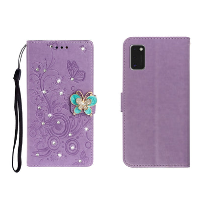 Purple embossed leather phone wallet case with butterfly rhinestone clasp and card slots, wrist strap.