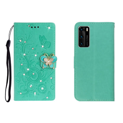 Green embossed leather phone wallet case with butterfly rhinestone clasp and card slots, wrist strap.