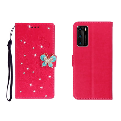 Red embossed leather phone wallet case with butterfly rhinestone clasp and card slots, wrist strap.