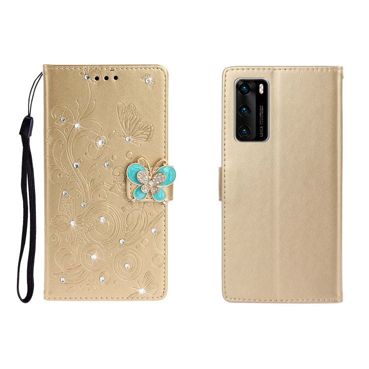Golden-beige embossed leather phone wallet case with butterfly rhinestone clasp and card slots, wrist strap.