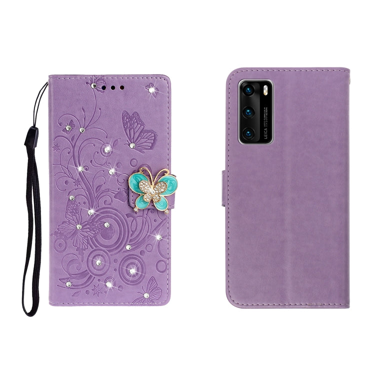 Purple embossed leather phone case with rhinestone butterfly detail and wrist strap