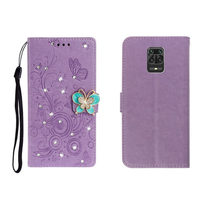 Purple embossed leather phone wallet case with butterfly rhinestones, wrist strap, card slot