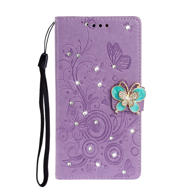 Purple embossed leather phone wallet case with butterfly rhinestone applique and wrist strap