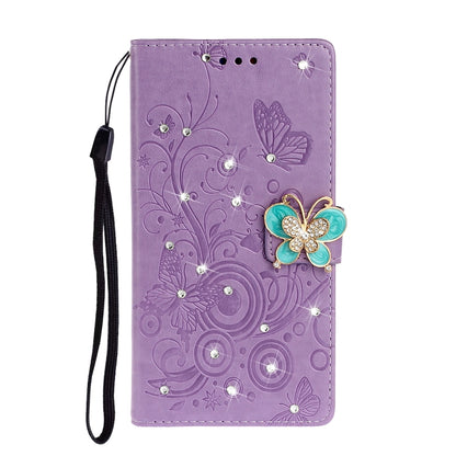 Purple embossed leather phone wallet case with butterfly rhinestone applique and wrist strap