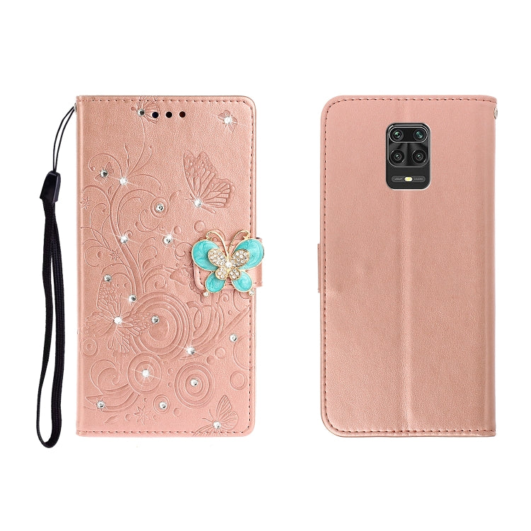 Rose gold embossed leather phone wallet case with butterfly rhinestone applique and wrist strap