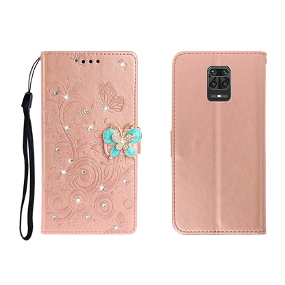 Rose gold embossed leather phone wallet case with butterfly rhinestone applique and wrist strap