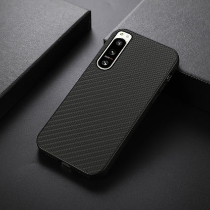 Black carbon fiber texture PU phone case, angled view with camera cutouts