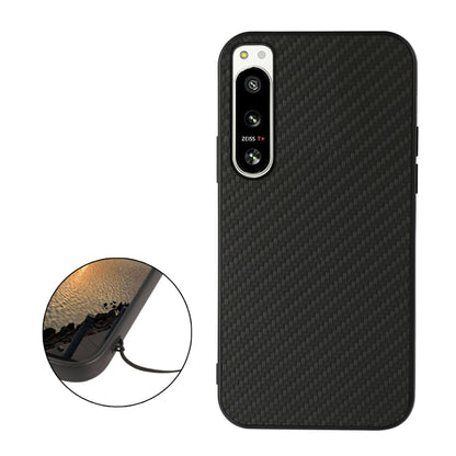 Black carbon fiber texture PU phone case with raised camera ring and side cutouts