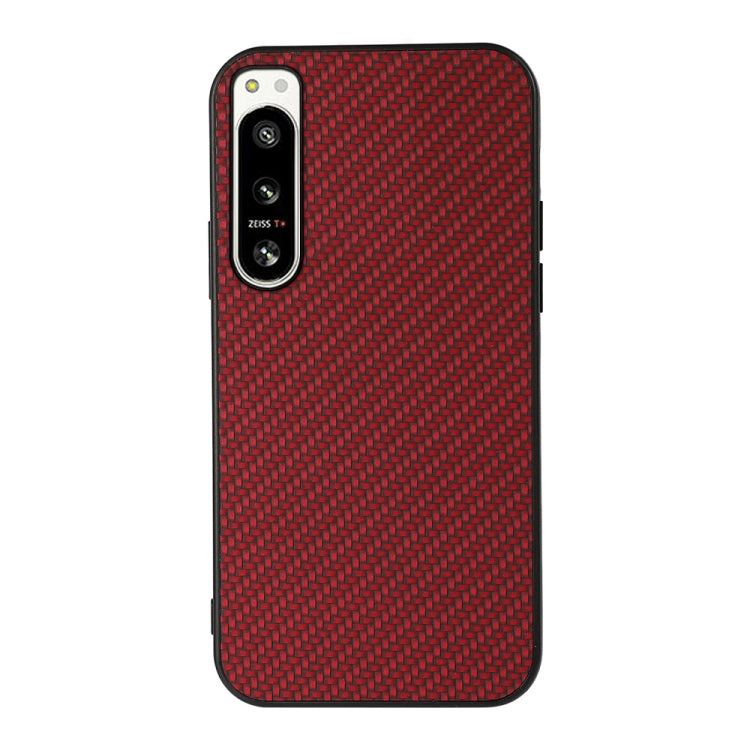 Red carbon fiber texture PU phone case with raised camera frame and side buttons