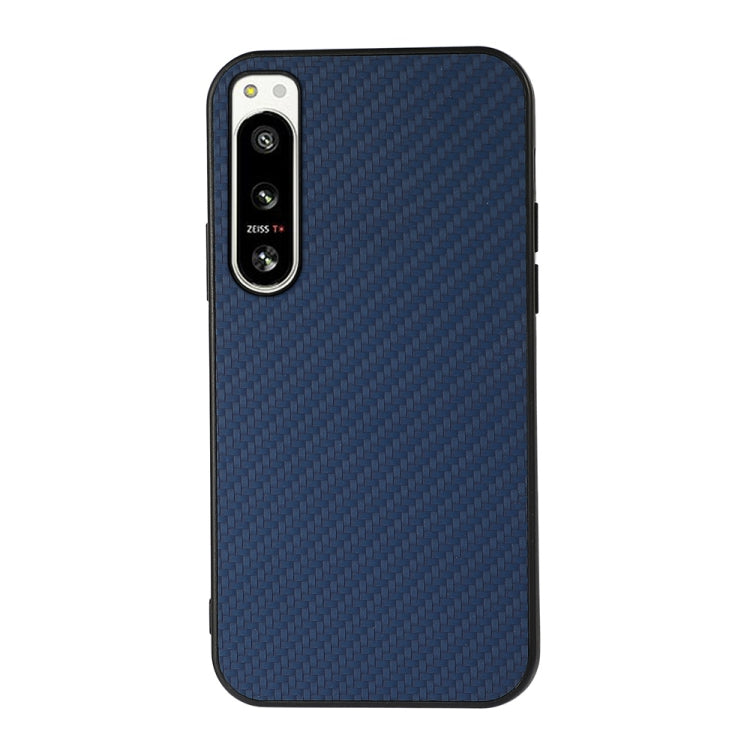 Blue carbon fiber texture PU phone case with raised camera frame and access openings