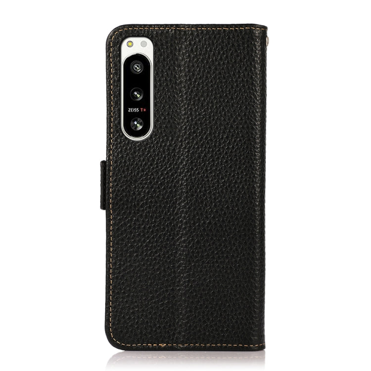 Black litchi-texture leather folio phone case with camera cutout and side magnetic closure