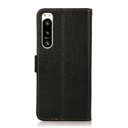 Black litchi-texture leather folio phone case with camera cutout and side magnetic closure