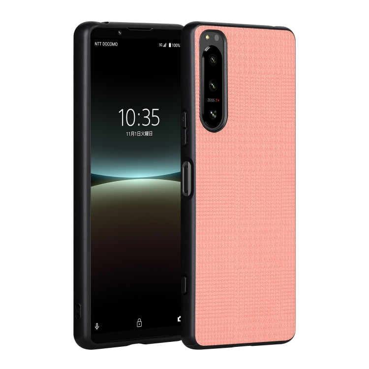 Pink shockproof phone case on phone with side buttons and camera cutout