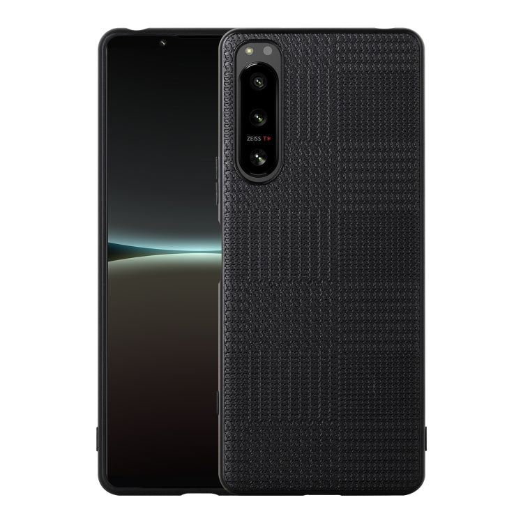 Black shockproof phone case with textured back and camera cutout