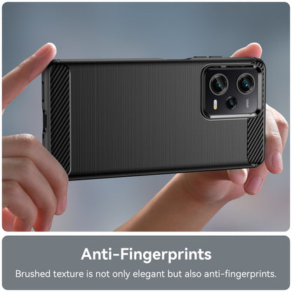 Brushed TPU phone case held in hands, with carbon-fiber corner accents