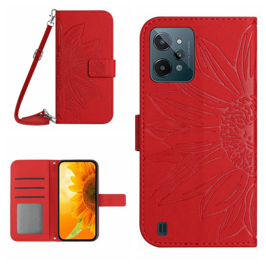 Red flip leather phone case with embossed flower pattern and lanyard strap