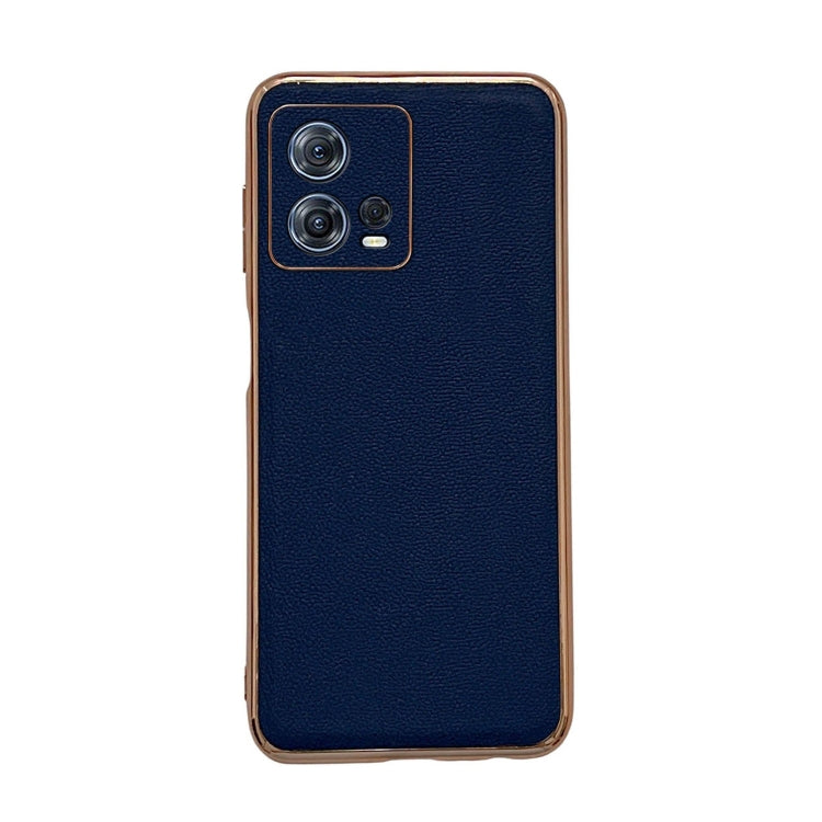 Genuine leather phone case with camera cutout, textured dark blue surface, protective border