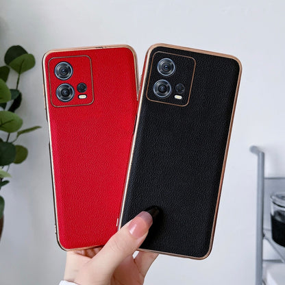Black and red leather phone cases held together, camera cutouts visible