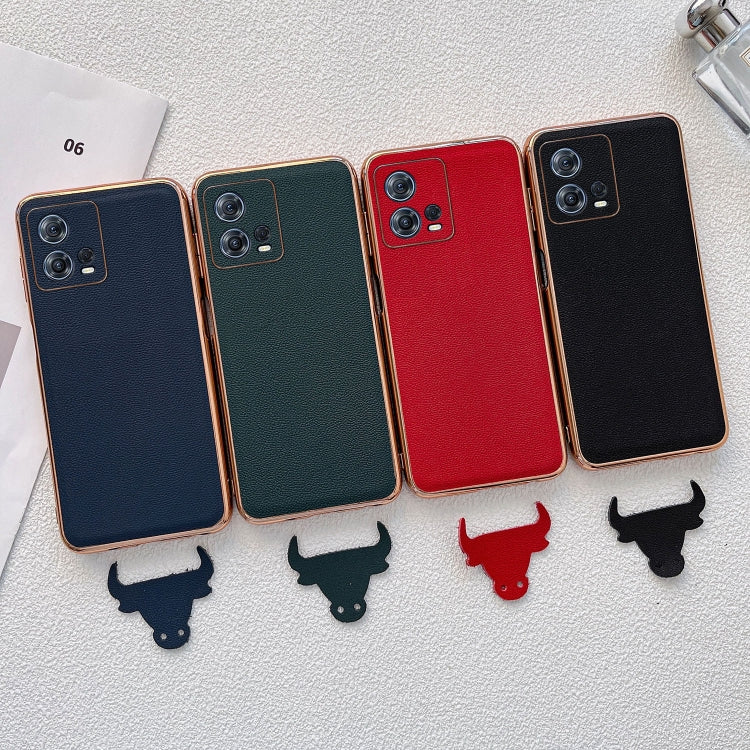 Assorted leather phone cases in blue, green, red, and black with small charm silhouettes