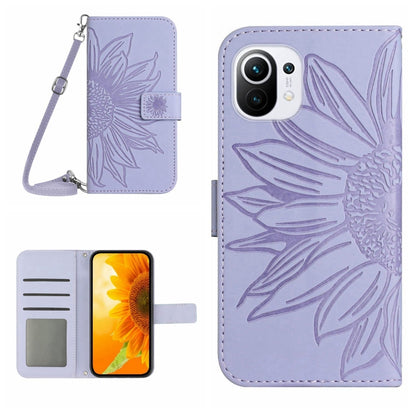 Light purple flip phone case with sunflower pattern, card slots, and wrist lanyard