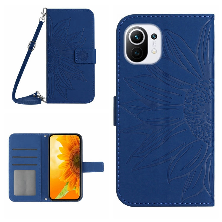 Blue flip phone case with sunflower pattern, card slots, and wrist lanyard