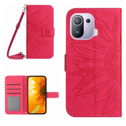 Pink flip leather phone case with sunflower pattern, card slots, and wrist lanyard.