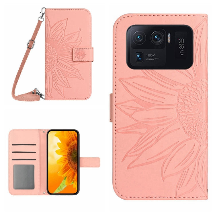 Light pink flip leather phone case with sunflower pattern, card slots, and wrist lanyard.