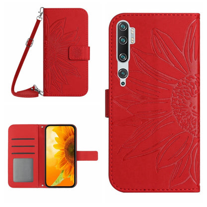 Red flip leather phone case with sunflower pattern, card slots, and wrist lanyard strap.