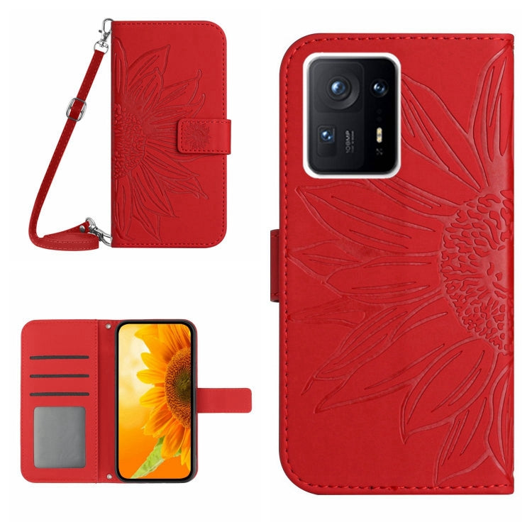 Red flip leather phone case with sunflower pattern, card slot, and wrist lanyard.
