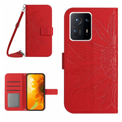 Red flip leather phone case with sunflower pattern, card slot, and wrist lanyard.