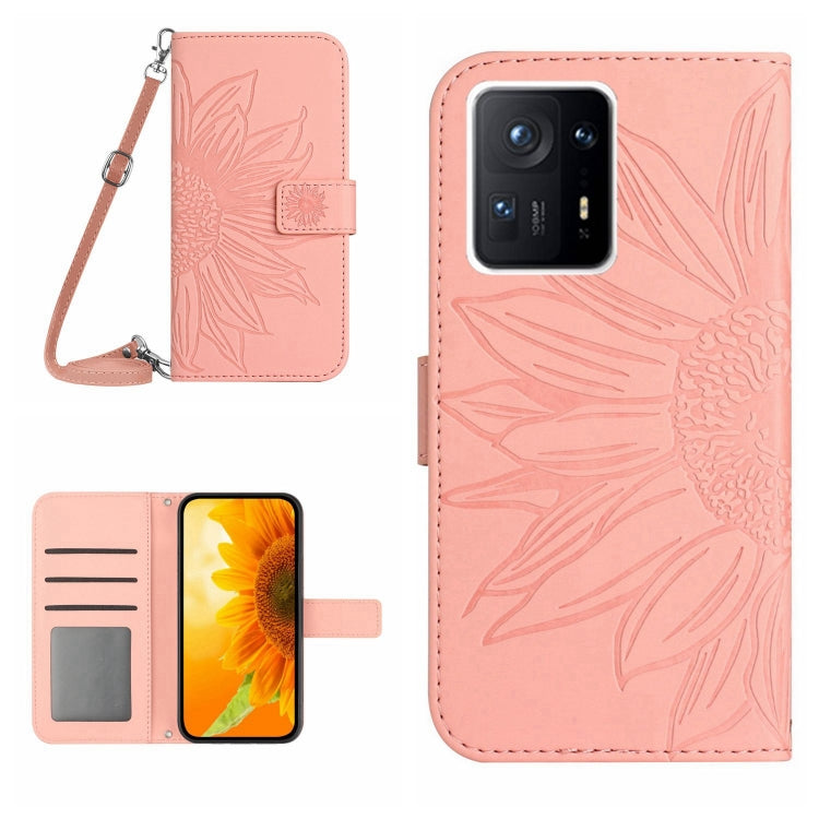 Light pink flip leather phone case with sunflower pattern, card slot, and wrist lanyard.