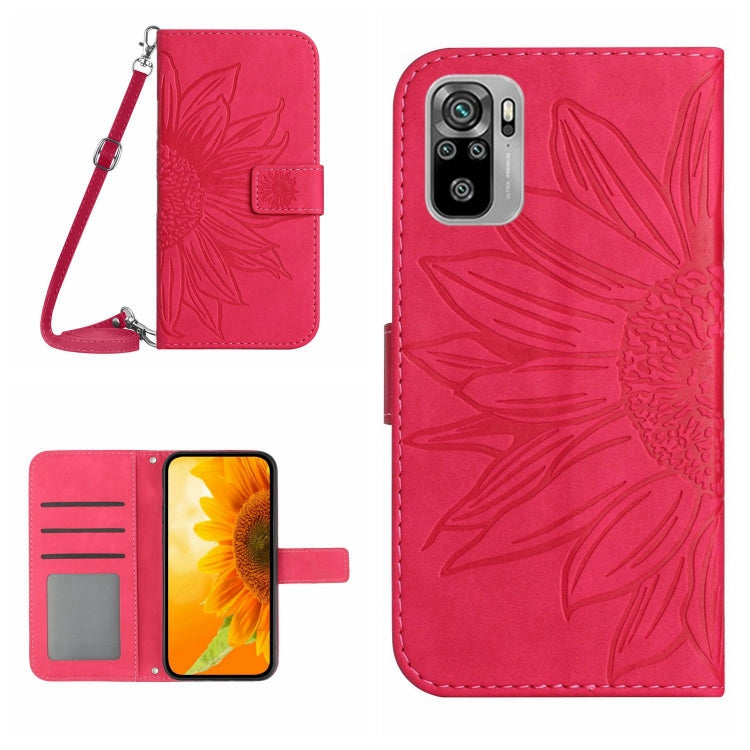 Pink flip leather phone case with sunflower embossing and card slots; lanyard attached