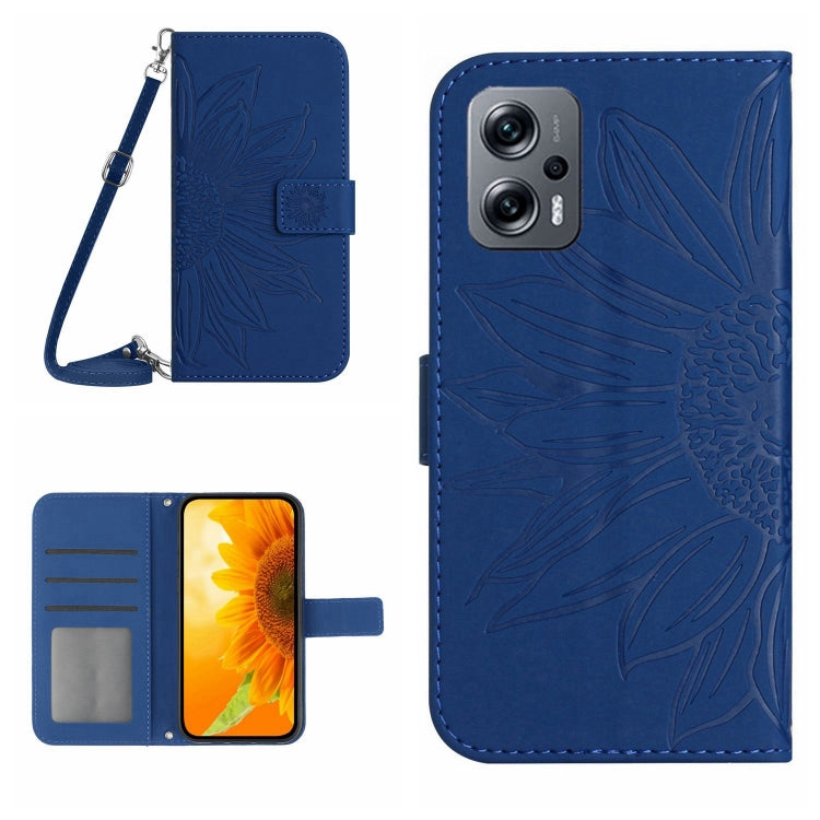 Blue flip leather phone case with sunflower embossing and card slots; lanyard attached