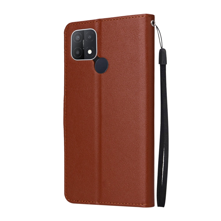 Brown leather phone flip case with camera cutout and hanging wrist strap