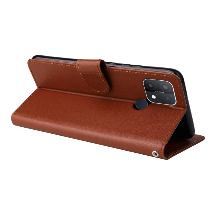 Brown leather flip phone case with landscape kickstand and camera cover