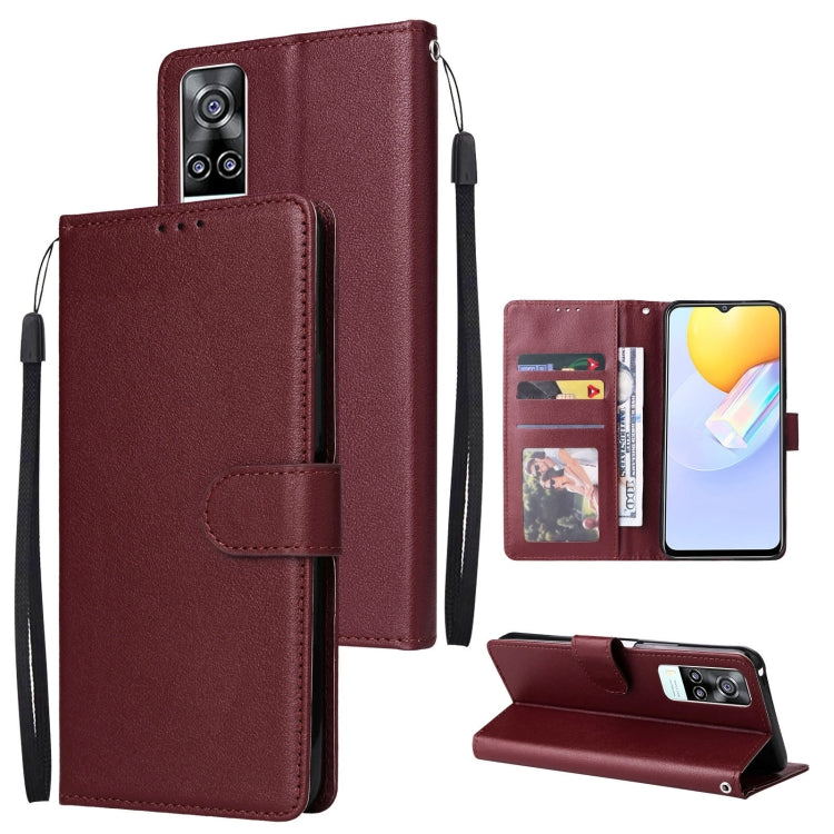 Burgundy leather wallet phone case with horizontal flip and three card slots, wrist strap