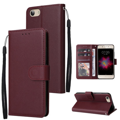 Wine red leather flip phone case with three card slots and wrist strap, includes stand