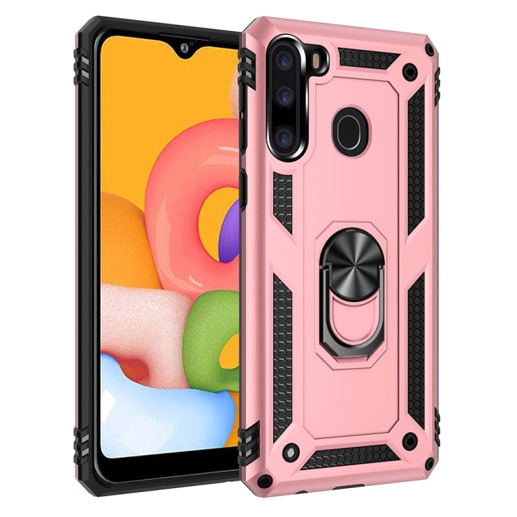 Rugged light pink protective phone case with raised edges and rotating ring stand
