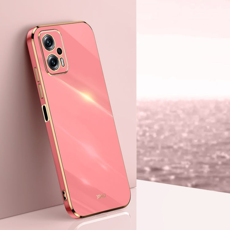 Electroplate TPU phone case, coral pink with gold trim and camera cutouts