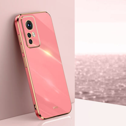 Pink electroplate TPU phone case with gold trim, raised camera bezel, and cutouts