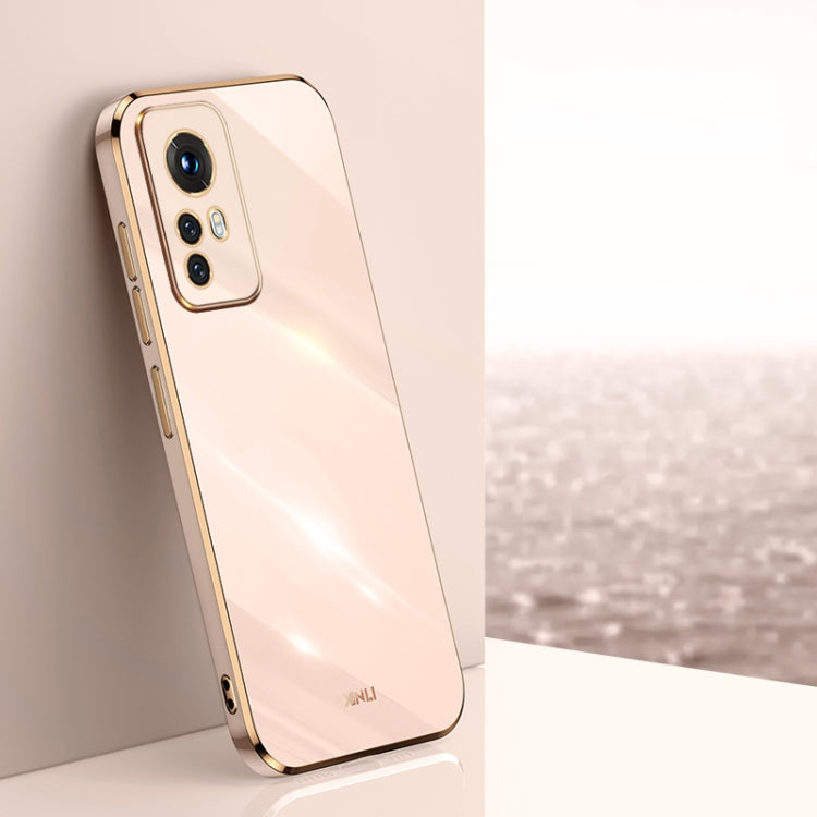Light peach electroplate TPU phone case with gold trim, raised camera bezel, and cutouts