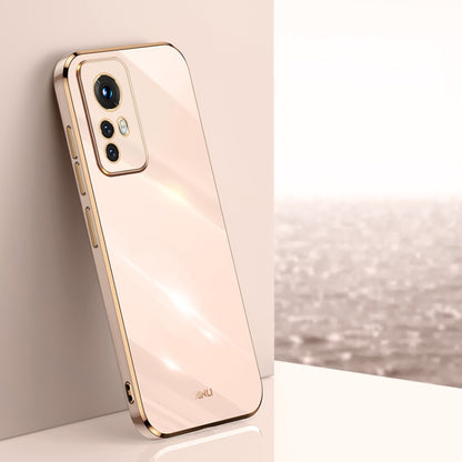 Light peach electroplate TPU phone case with gold trim, raised camera bezel, and cutouts
