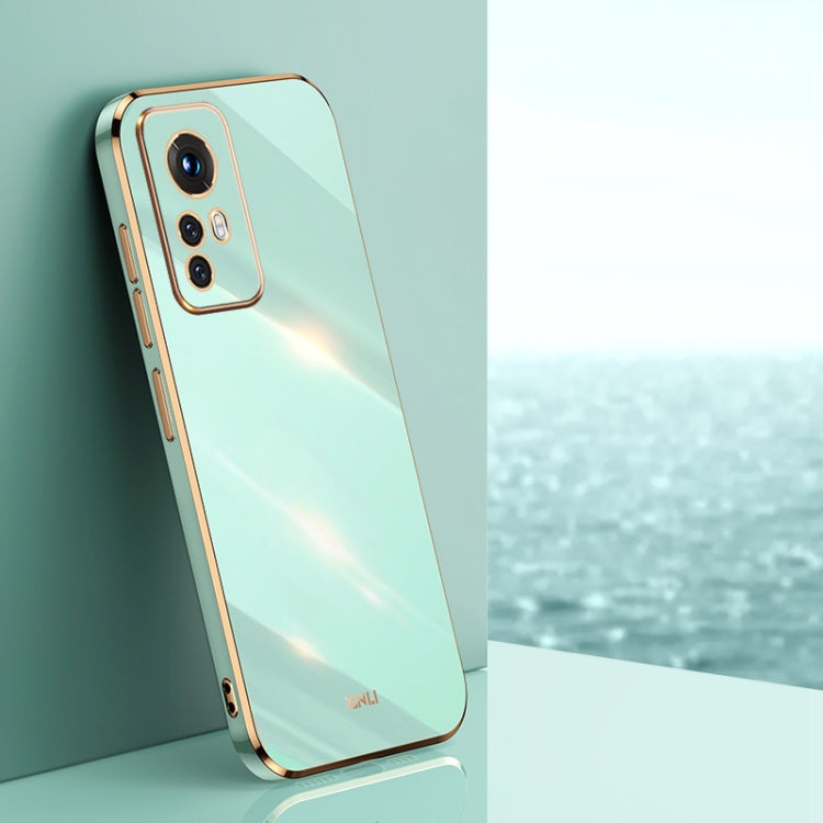 Mint green electroplate TPU phone case with gold trim, raised camera bezel, and cutouts